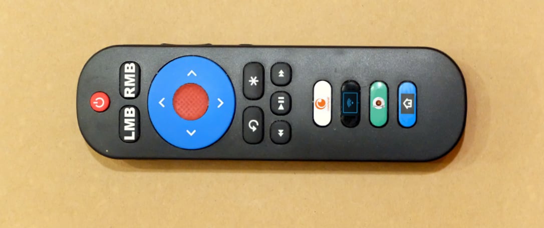 Here's a writer's conception of a nonexistent perfect computer-television remote, based on the lines of a cheap replacement Roku remote. It would have left and right mouse buttons, a TrackPoint-style pointing nubbins in the center of the blue circle, and the rest of the buttons would be user-programmable. No one makes these, but someone should. (Credit: Dennis E. Powell)